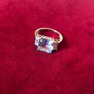 Woman's 10k gold ring with aquamarine and 2 white sapphire baguettes THL